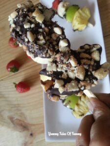 Fruity and Nutty Sticks coated with chocolate and nuts