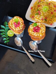 Rajgira sabudana khichdi cones served in a black platter with khichdi on the side