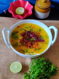 Masoor dal recipe | Masoor dal tadka served with lemon and coriander leaves on the side