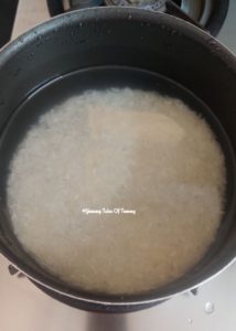 Soaked rice in black pan