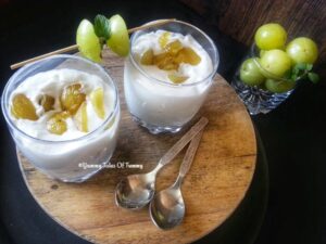 Gooseberry fool served in glasses with Indian gooseberry on the side