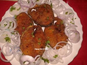 Fish Fry Recipe (Pan fried crispy Fish) served with onion rings 