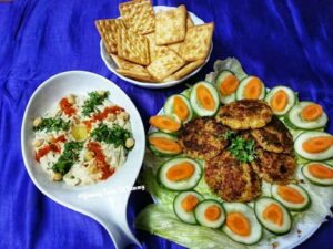 Easy Homemade Hummus Recipe served with falafel and salad 