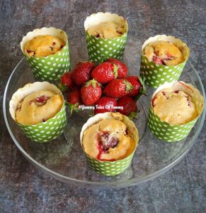 Strawberry muffins served with fresh strawberries 