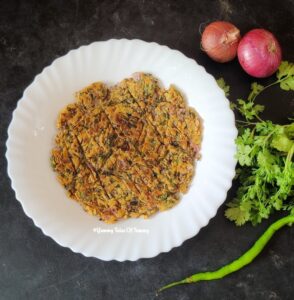 Sindhi Basar wari Koki | Sindhi Koki Recipe | Onion Flatbread served on white plate