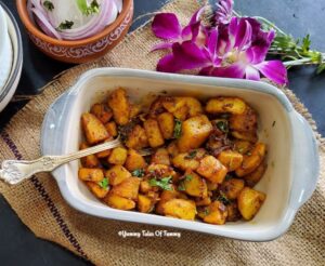 Jeera Aloo Recipe (Cumin Potatoes ) | Zeera Alu served in a rectangular bowl 