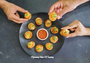 Top view of Air fryer pizza vol au Vents served in black platter