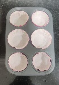 Muffin pan lined with muffin liners 