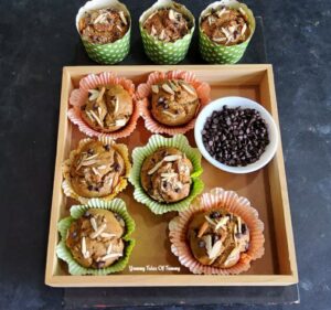 Vegan Whole Wheat Banana Muffins served in wooden tray with chocolate chips 