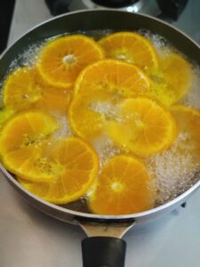 Orange slices cooked in sugar syrup 