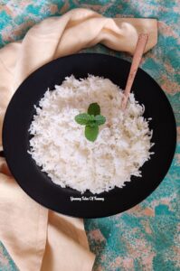 Cooked rice kept in black platter 