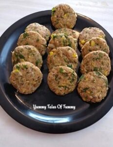 Ready to shallow fry tikki placed on black plate