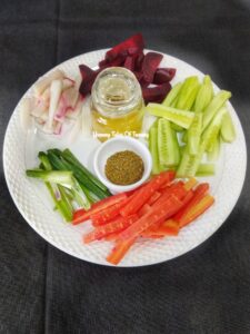 Chopped salad veges, pickle masala and salad dressing 