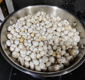 Roasted Makhana/Fox nuts in a steel kadai