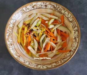 julienned guava, raw mango and carrots in a bowl