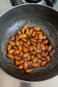 Pan roasted almonds combined with honey, oil and water