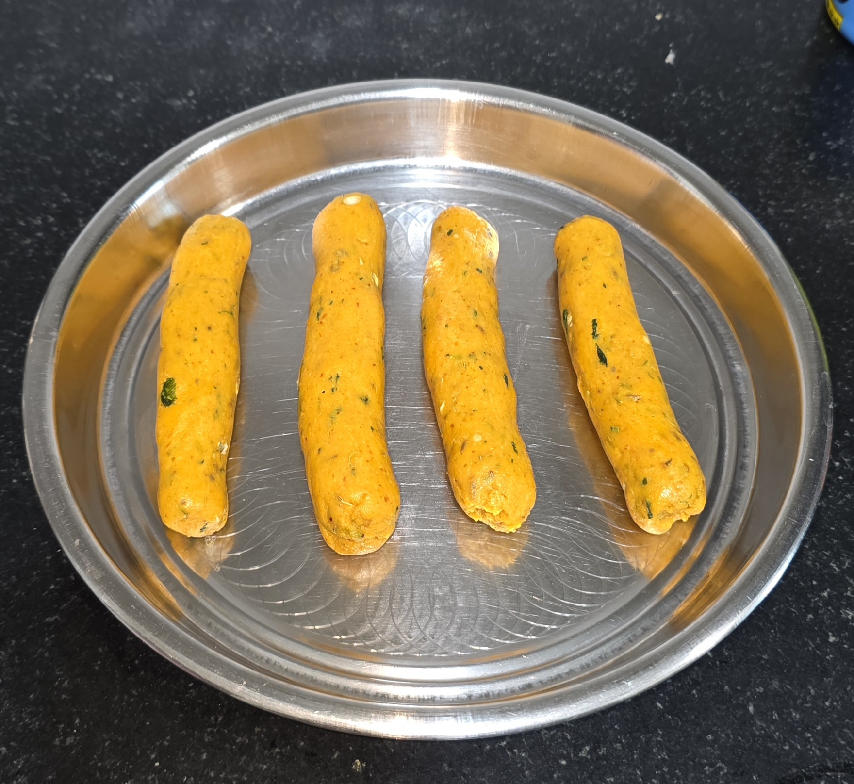 Rolled gatte ready to be cooked and dunked in curry