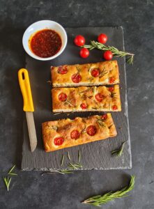 No Knead Mini Focaccia Bread cut into slices and served with chilli oil
