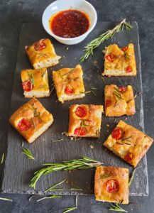 Sliced focaccia bread served with chilli oil