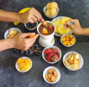 Family members relishing the chocolate fondue 