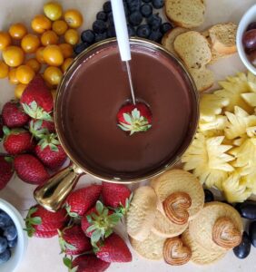 Chocolate fondue served with various dipping options 