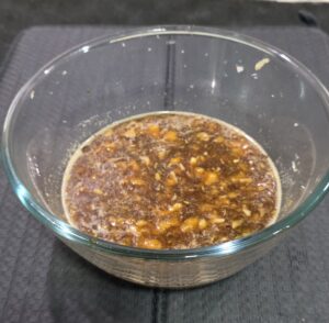 Mixture of bananas, grated coconut, fennel seed and jaggery water