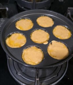 Banana Appam | Whole Wheat Banana Paniyaram batter filled in cavities 