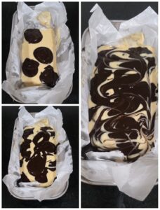 Eggless Marble Loaf Cake batter filled in baking pan ready to be baked with marble effect 