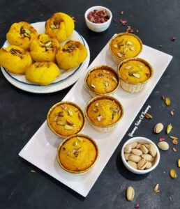 These Mawa Kesar Pista Muffins (Eggless) | Eggless Mawa muffins served on white platter