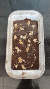 Eggless Whole Wheat Date Chocolate Cake batter in loaf tin