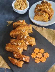 Sliced Best Carrot Cake Recipe (Vegan) laid on black platter 