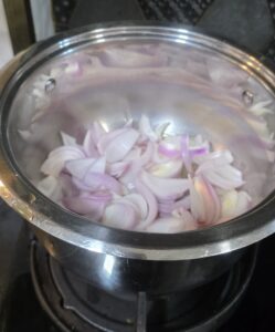Thinly sliced onions in a pan