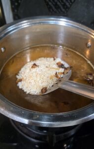 Soaked rice added to caramelised onion water