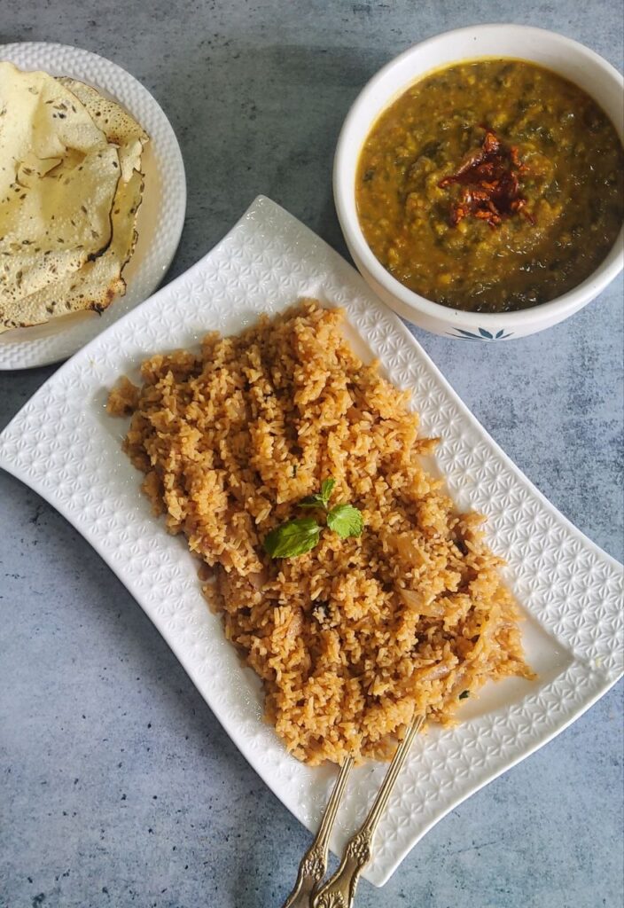 Bhuga Chawar | Caramelized Onion Rice served with dal palak and roasted papad